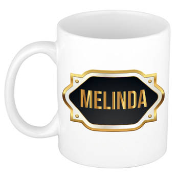 Melinda naam / voornaam kado beker / mok met goudkleurig embleem - Naam mokken