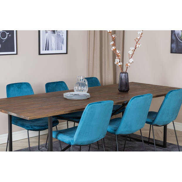 Padang eethoek eetkamertafel teakhout en 6 Muce eetkamerstal velours blauw.