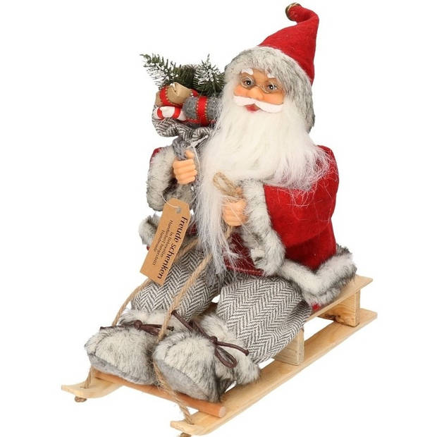 Kerstman op slee decoratie pop 30 cm - Kerstman pop