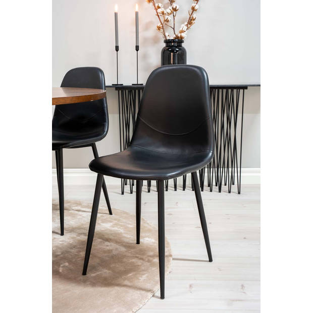 Copenhagen eethoek tafel bruin en 6 Polar stoelen zwart.