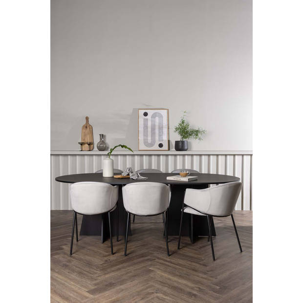 Bootcut eethoek tafel zwart en 6 Evelina stoelen grijs.